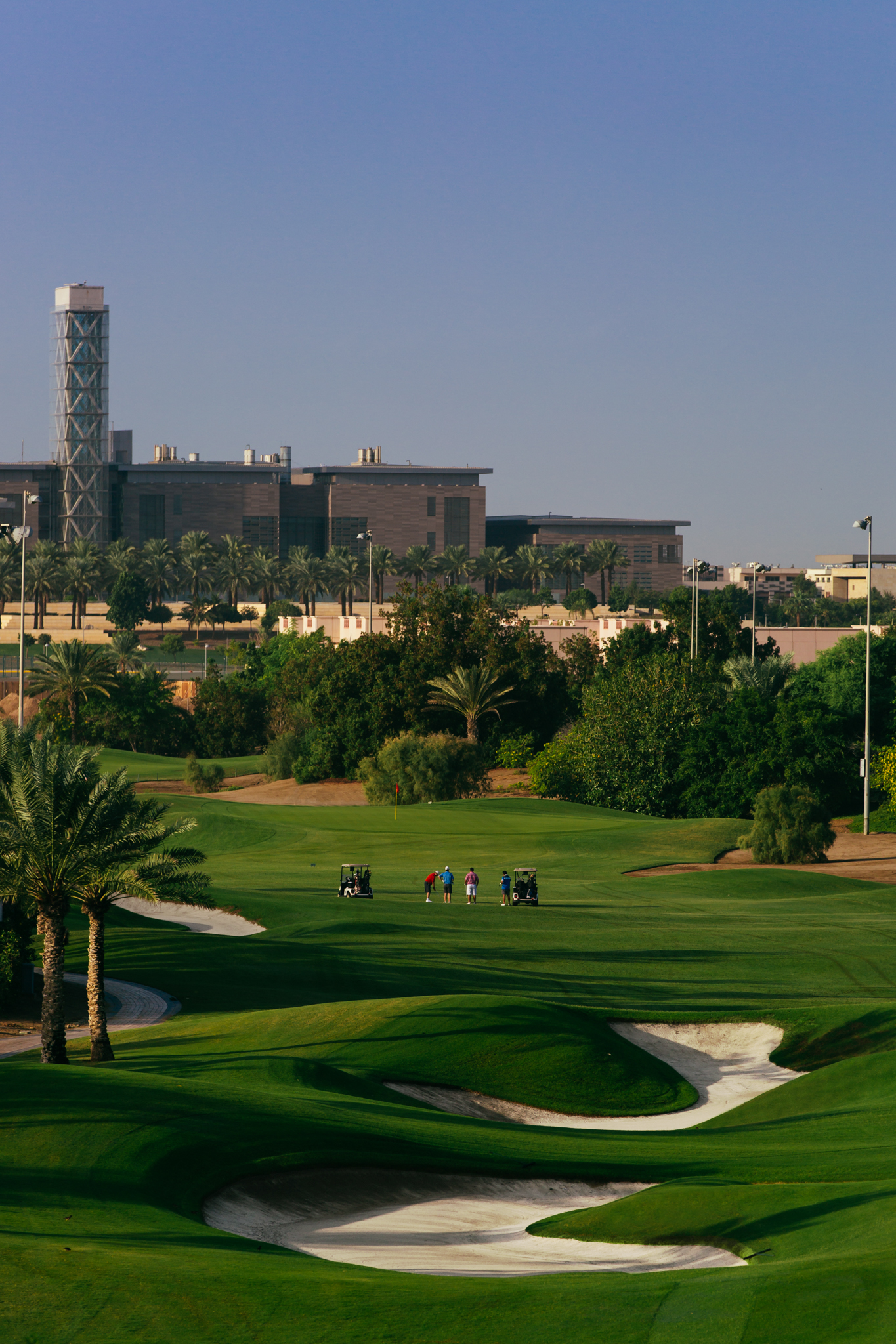 Golfers on a professionally maintained golf course